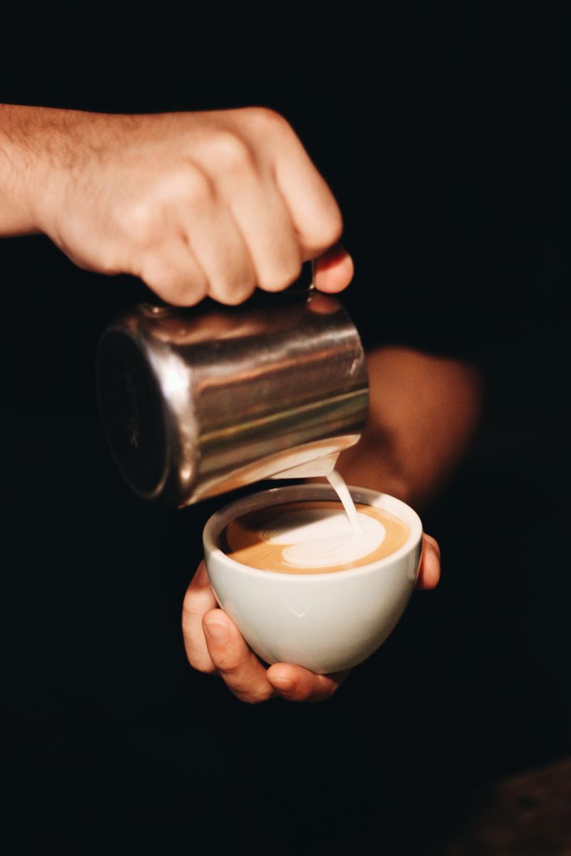 Barista pouring latte art